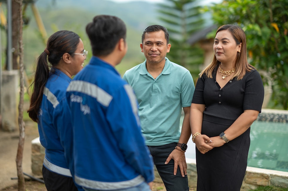 Electrification allows expansion of resort in Sitio Katandungan. Jojo and Socorro “Korina” Masanegra (3rd and 4th from left, respectively) confer with representatives from Davao Light, who connected Sitio Katandungan in the Marilog district to the grid, allowing the couple to transform their resort from a single cabin into three concrete houses and a larger swimming pool.